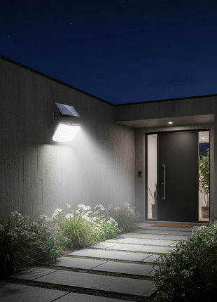 Foco solar de parede com painel solar e luz LED branca junto à entrada
