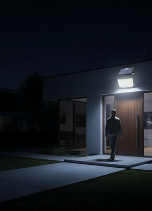 Foco solar exterior de parede a emitir luz LED branca
